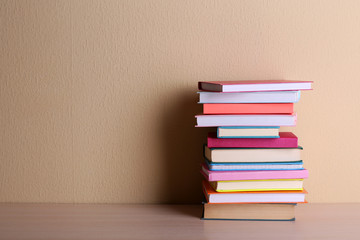 Stack of books on shelf.