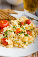 Scrambled eggs with baked tomatoes and chives, panini Scrambled eggs with baked tomatoes