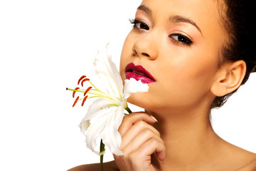 Fototapeta premium Beauty face of woman with lily flower. 