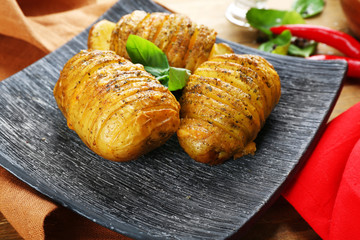 Baked potatoes in plate, closeup