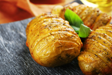 Baked potatoes in plate, closeup
