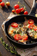 Baked eggplant stuffed with vegetables and mozzarella cheese with addition aromatic herbs. Delicious vegetarian dish