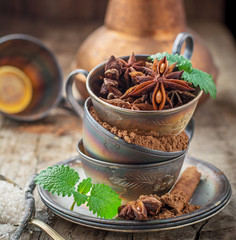 Cocoa powder, star anise, cinnamon sticks, mint