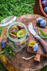 Homemade canned plums in summer