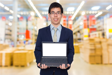 Business man holding digital laptop computer