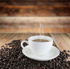White coffee cup and roasted coffee beans.