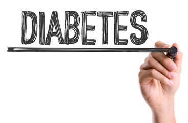 Hand with marker writing the word Diabetes