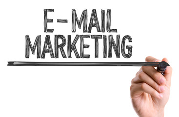 Hand with marker writing the word E-Mail Marketing