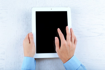 Hands working in the office with tablet on white table