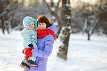 Fototapeta premium Young woman with her toddler son