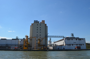 Fototapeta premium view on industrial sites next to canal