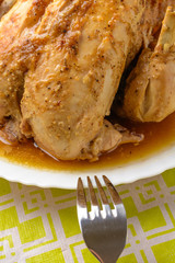 Baked chicken on a white plate