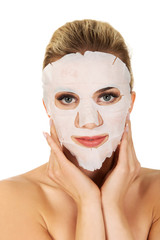 Young woman with facial mask