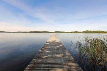 wooden jetty on Ungurs lake in Latvia