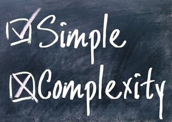 simple and complexity choice sign on blackboard
