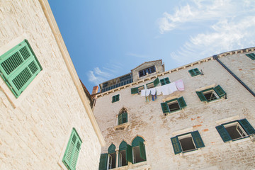     Windows on old traditional housed in Sibenik, Croatia, facade details 