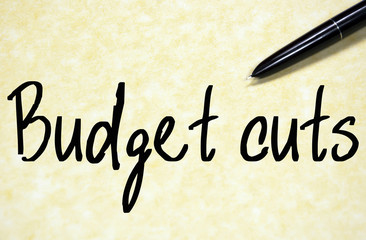 budget cuts text write on paper