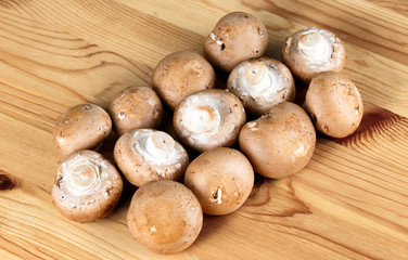 Fresh mushrooms on wooden desk background