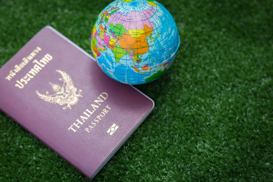 Photo of passport, money and world map.