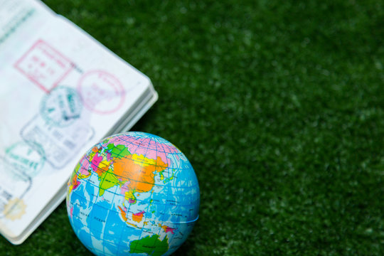 Photo of passport, money and world map.