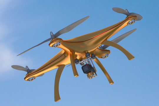 Gold drone flying in blue sky