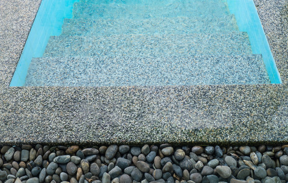 stone on the edge of the swimming pool