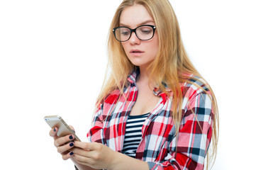 Teenage girl or young woman in glasses with cell phone
