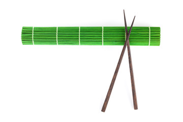 Chopsticks over bamboo mat