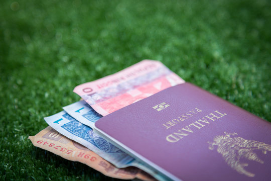 Photo of passport, money and world map.