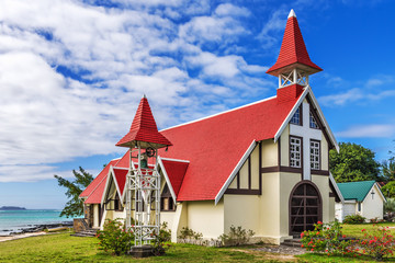 Notre Dame Auxiliatrice Church with distinctive red roof at Cap Malheureux, Mauritius - 89789404
