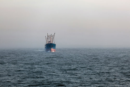 Cargo ship in fog