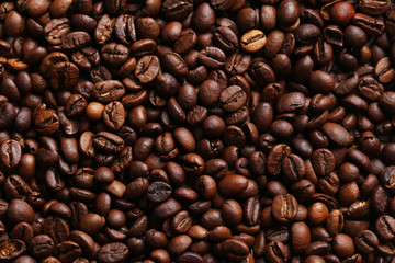 Roasted coffee beans background, close up