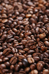 Roasted coffee beans background, close up