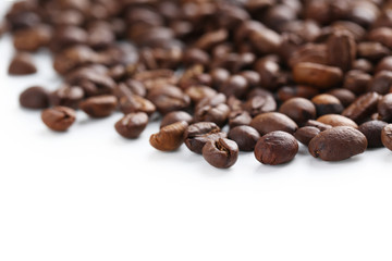 Roasted coffee beans on a white background