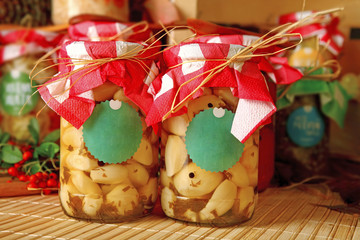 Homemade canned preserved vegetables in jars.
