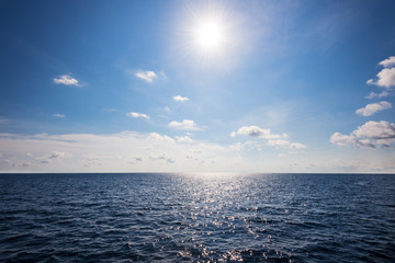 Sun on blue sky and sea in summer Thailand