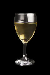White wine in a glass isolated on black.