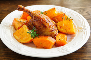 Roast duck with pumpkin and oranges.