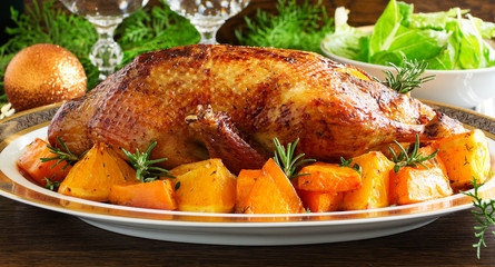 Roast duck with pumpkin and oranges.