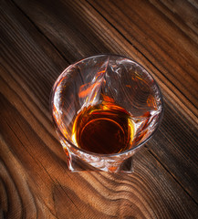 Whiskey, bourbon, brandy, or cognac on log table