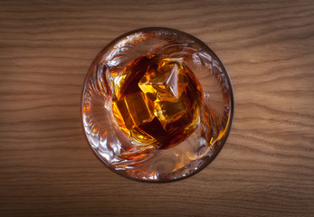 Whiskey, bourbon, brandy, or cognac on log table