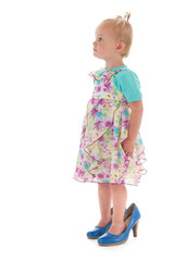 Toddler girl in mothers big shoes