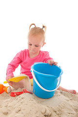 Little toddler playing in the sand