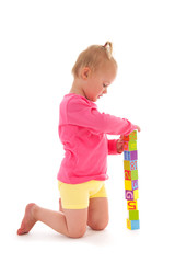 Toddler girl playing with blocks