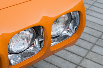 Close-up of a muscle car headlights