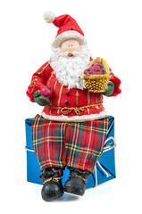 Santa Claus figure sitting on a gift box