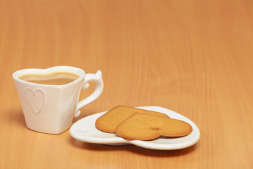 Gingerbread cookies and tea coffee on table.