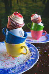 Cupcakes on stacked teacups