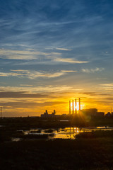 Naklejka premium Power plant during sunset