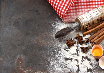 Flour, eggs, rolling pin and cookie cutters. Christmas food